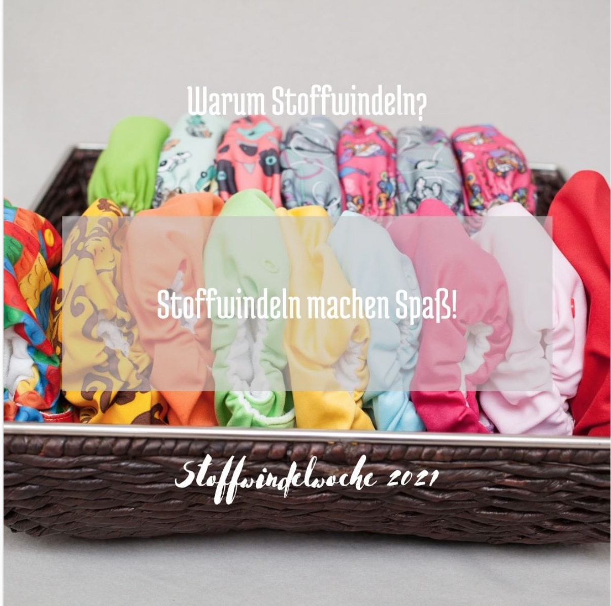 Eine kiste mit bunte Windeln. Schrift: Warum Stoffwindeln? Stoffwindeln machen Spa&szlig;! Stoffwindelwoche 2021